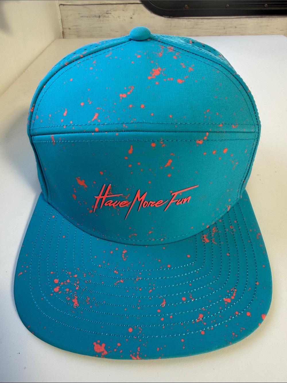 Have More Fun Melin Teal Snapback Hat with Coral Splatter